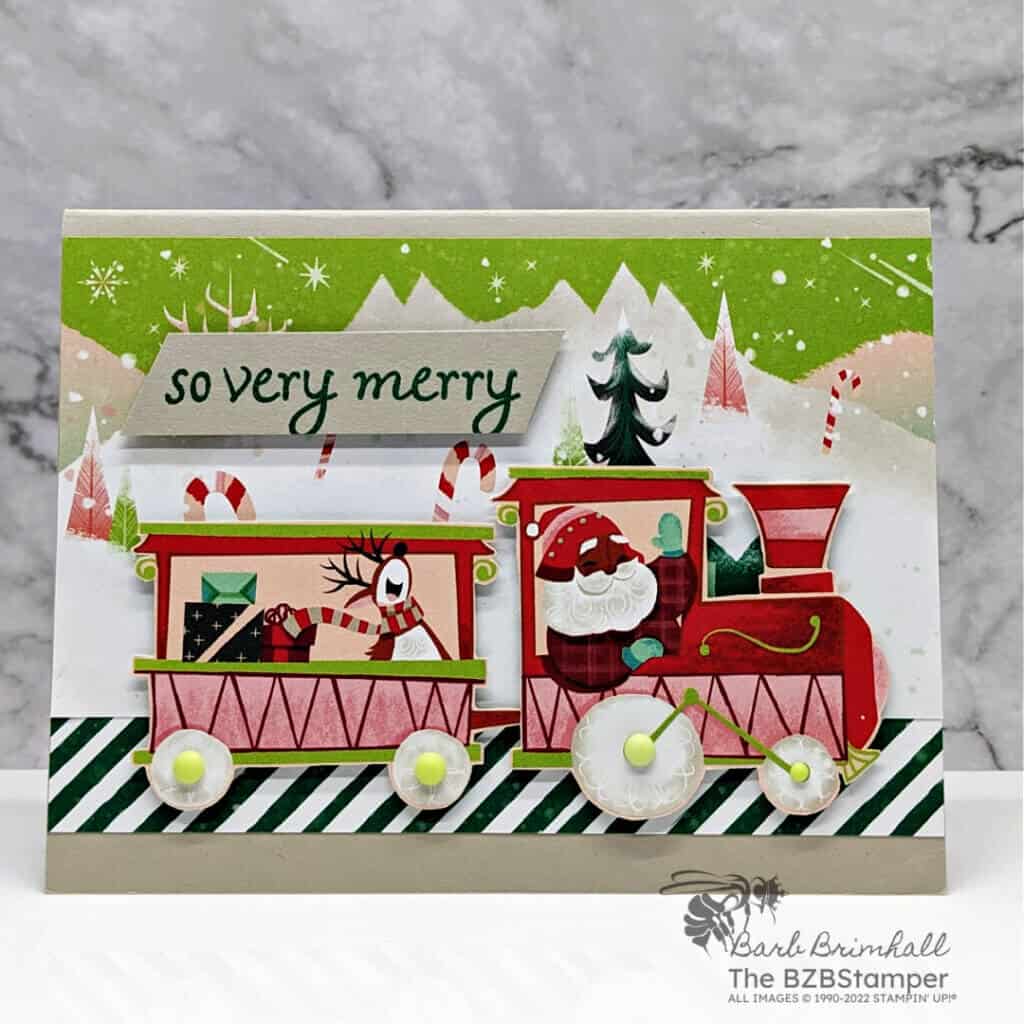 Whimsical Handmade Christmas Card 2 WHimsical Handmade Christmas card featuring paper that has a train and Santa and reindeer
