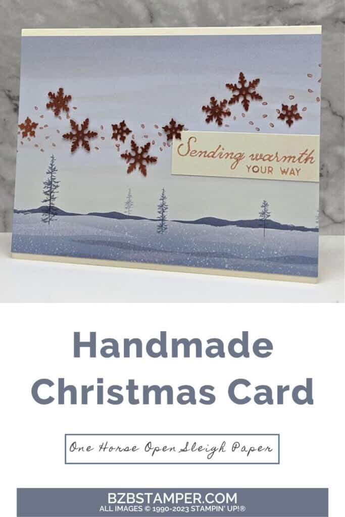 One Horse Open Sleigh Designer Series Paper with copper snowflakes and a sending warmth sentiment.