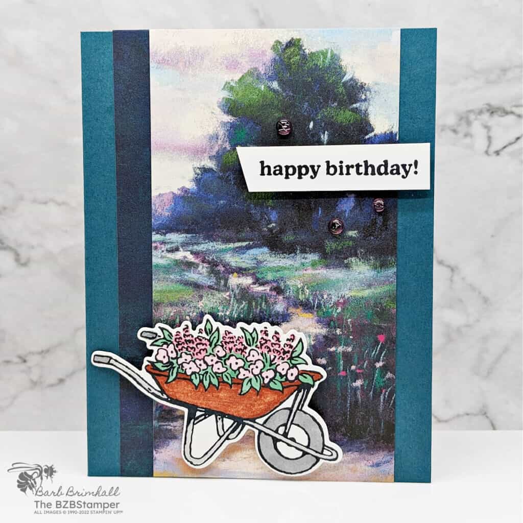 Garden Meadow Handmade Birthday Card 1 Handmade Birthday Card featuring the Garden Meadows Bundle in blues and greens with a wheelbarrow with flowers.