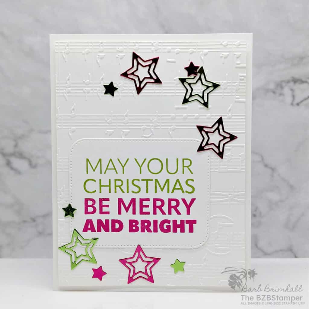 Stampin' Up! Joy To You Christmas Card featuring a May Your Christmas Be Merry & Bright sentiment in green and red with die-cut stars in the same color.