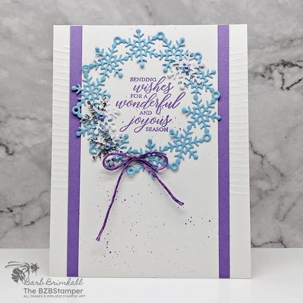 Wishes All Around Wreath Card 1 Christmas card in blues and purples featuring a wreath of snowflakes and a sentiment "sending wishes for a wondering and joyous season."