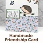 Happy Hedgehogs Handmade Card with blue and pink floral paper and hedgehog looking at a butterfly.
