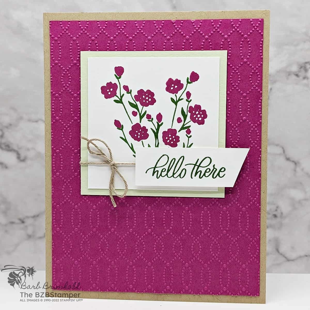 Softly Sophisticated Sale-A-Bration Bundle in kraft, magenta, and green featuring flowers, an embossed background that is part of the Bundle and a "hello there" sentiment.