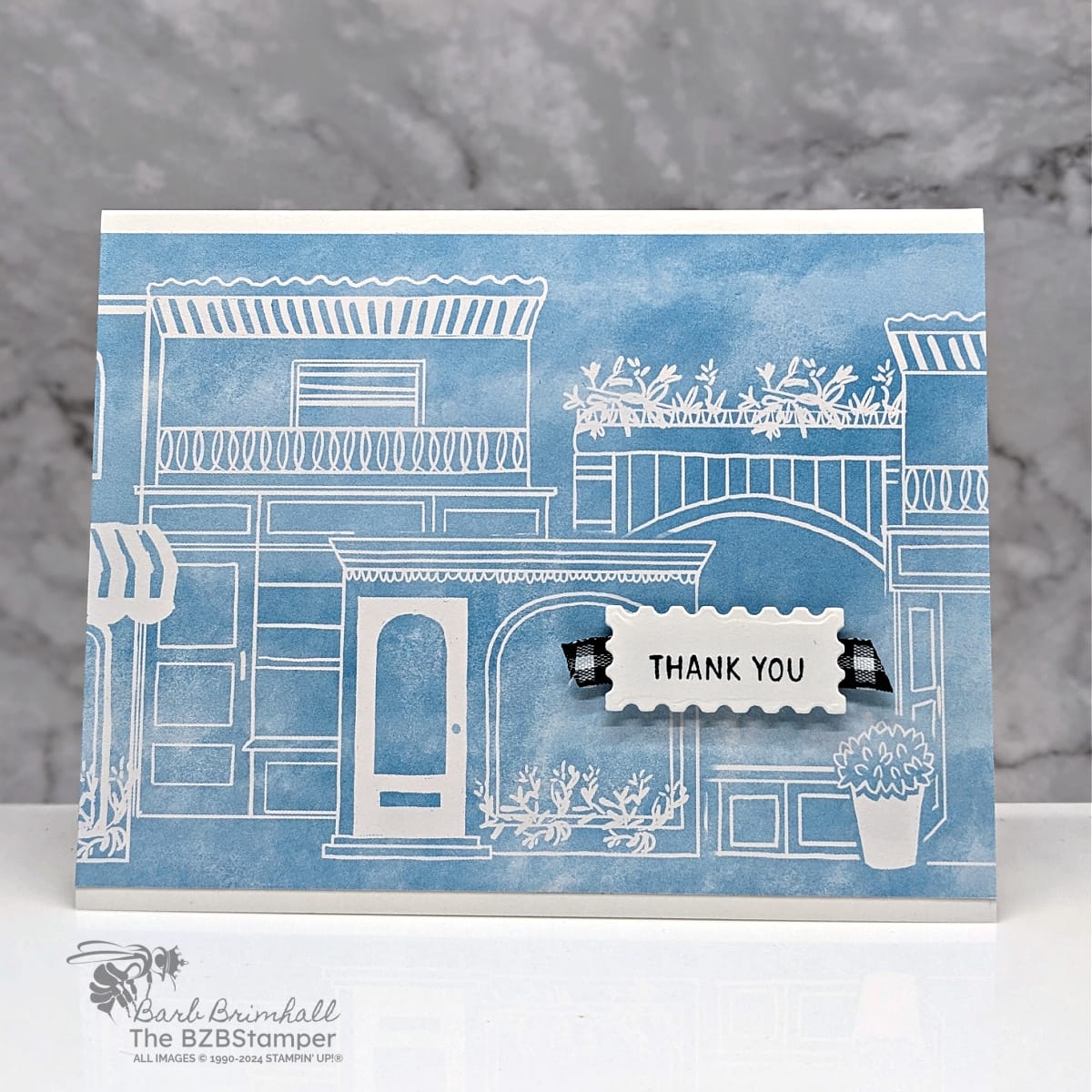 Thank You Card using the Les Shoppes Designer Paper 1 Thank You Card using the Les Shoppes Designer Paper in blue and white, with black gingham ribbon and a thank you sentiment.