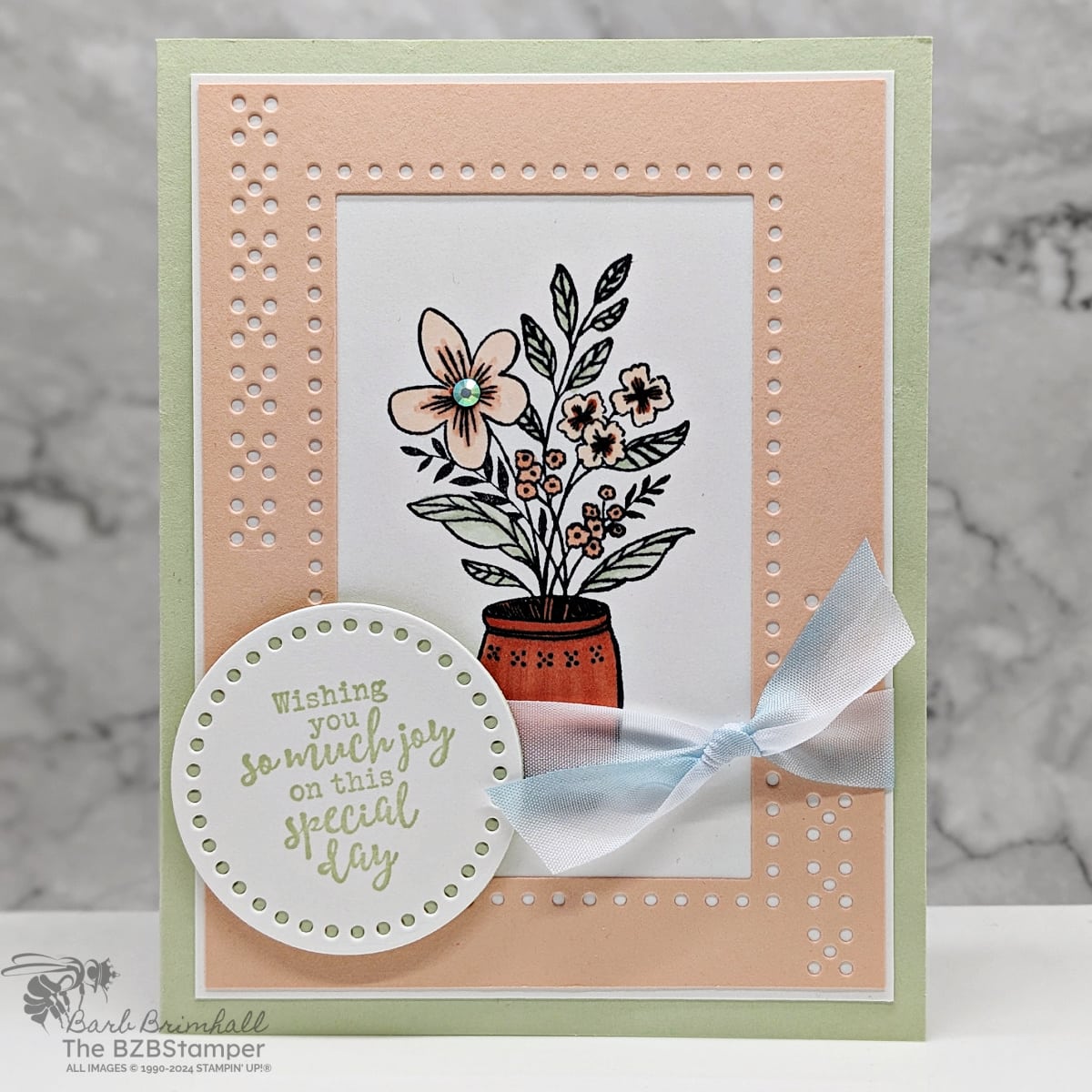 Tutorial Featuring The Everyday Details Bundle 1 Tutorial Featuring The Everyday Details Bundle in light pinks and greens. Features a vase with flowers and lots of die-cut details, including a sentiment on a circle and a blue ribbon.