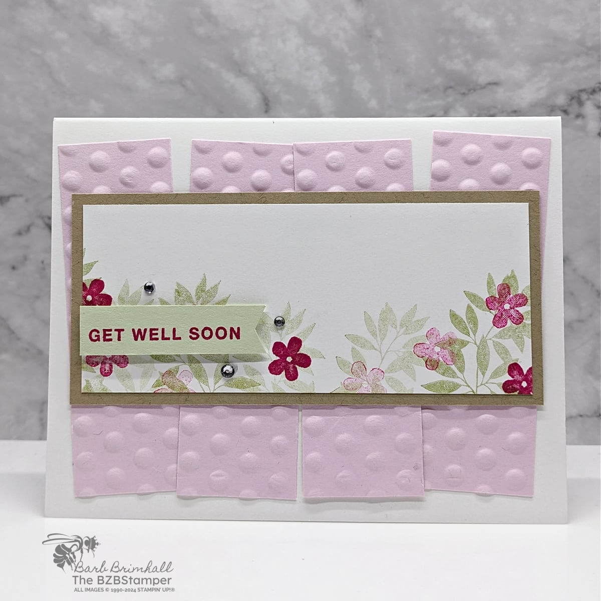 Get Well Card using the Darling Details Stamp Set 1 Get Well Card using the Darling Details Stamp Set in pinks and soft green. Embossed layer with flowers and leaves on a Kraft cardstock mat.