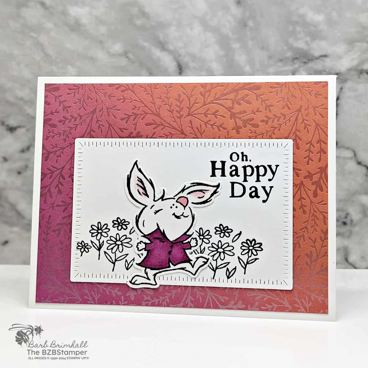 Spring Crafting Oh Happy Day Bunny Card 1 Spring Crafting: Oh Happy Day Bunny Card featuring an orange background paper with a bunny in a purple shirt playing among flowers.