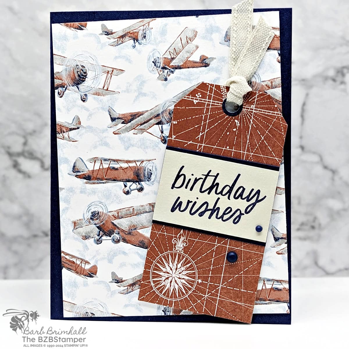 Take to the Sky Designer Paper 1 Masculine Birthday Card featuring the Take to the Sky Designer Paper by Stampin' Up! In Navy Blue and Browns, featuring old airplanes and a map paper, with a "birthday wishes" sentiment.