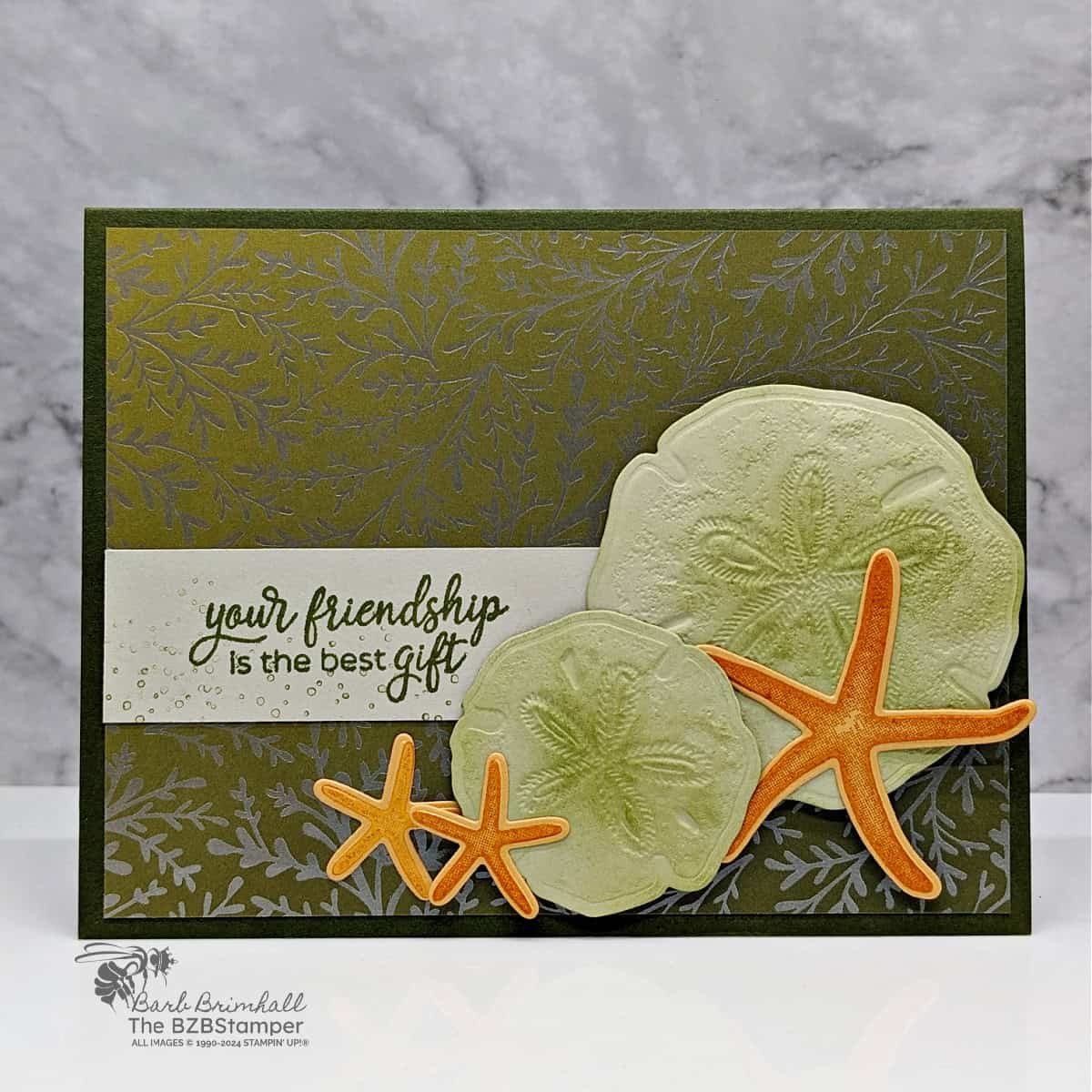 Handmade Seaside Wishes Friendship Card 1 Handmade Seaside Wishes Friendship Card featuring seashells and starfish with pretty paper background. Sentimet is "your friendship is the best gift."