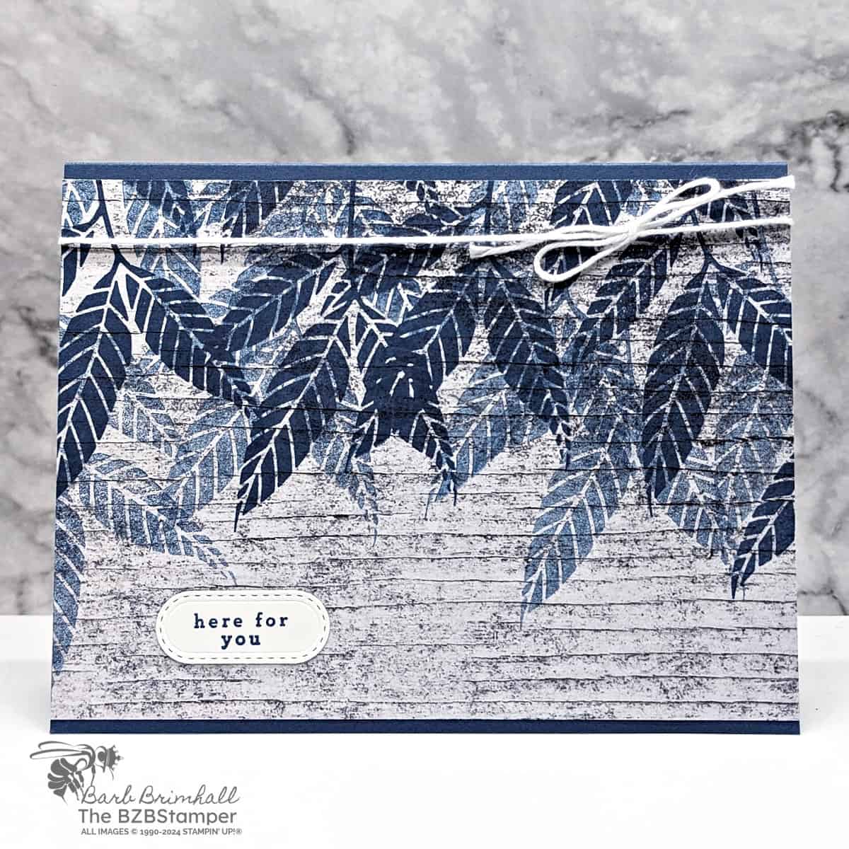 Simple Card Using The Changing Leaves Stamp Set 1 Simple Card Using The Changing Leaves Stamp Set in Navy Blue with a "here for you" sentiment and woodgrain background paper.