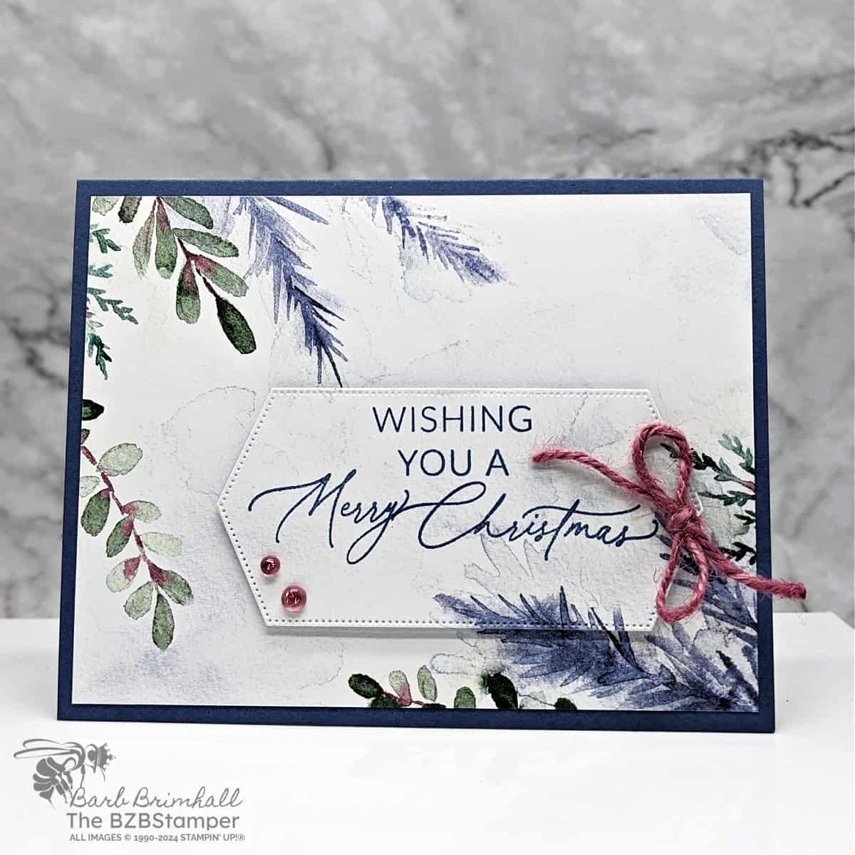 Simple Greetings of the Season Christmas Card 1 Simple Greetings of the Season Christmas Card in blues and mauves, with leaves as a "Wishing You A Merry Christmas" sentiment.