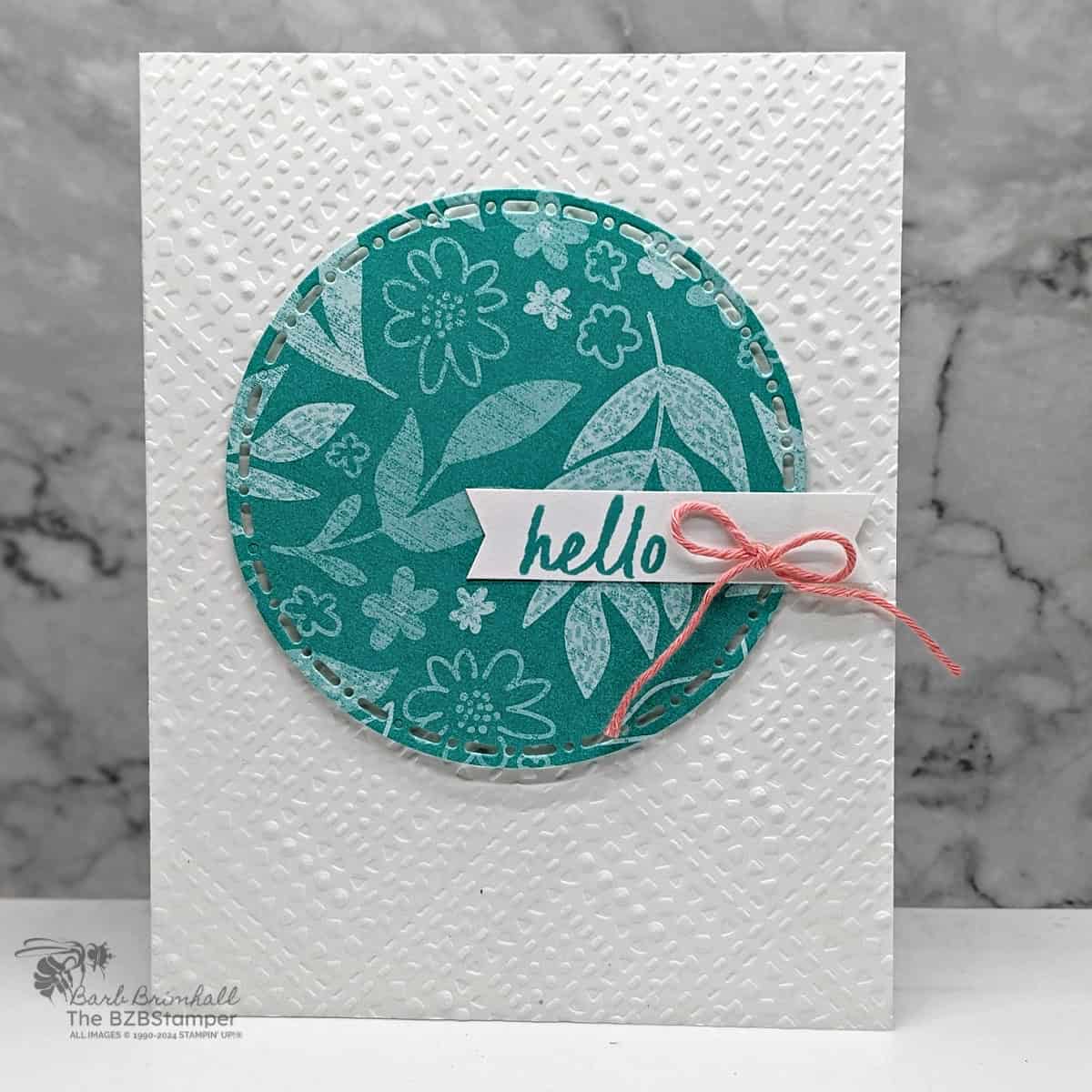 5 Minute Hello Card using Card Sketch 15 1 5 Minute Hello Card using Card Sketch 15 featuring white and blue elements, along with a coral bow. The focal point is a circle with sentiment attached.
