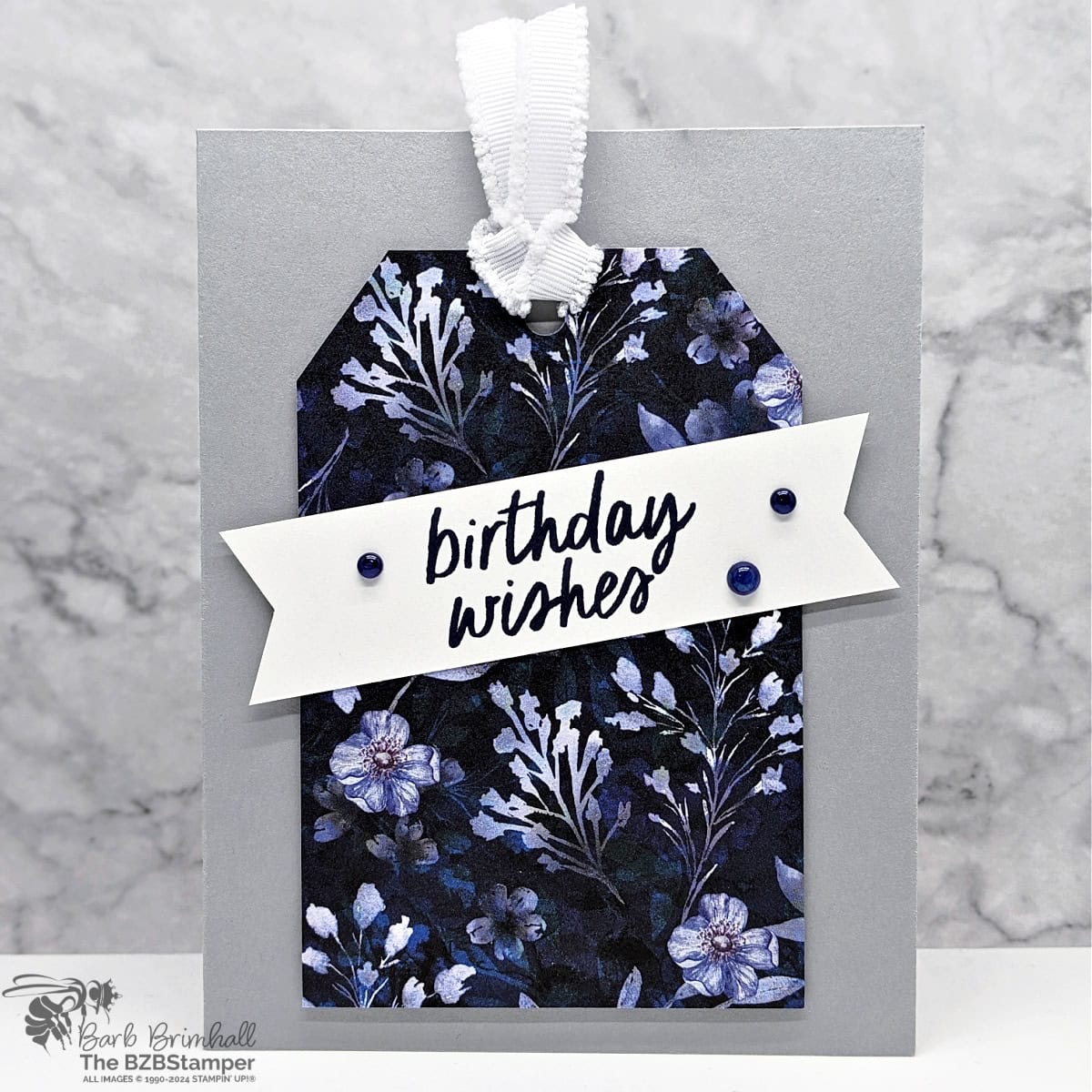5 Minute Birthday Card Using Holiday Card Sketch 1 1 5 Minute Birthday Card Using Holiday Card Sketch 1 featuring pretty Navy and Gray paper with a paper tag on the front and a "birthday wishes" sentiment on the tag.