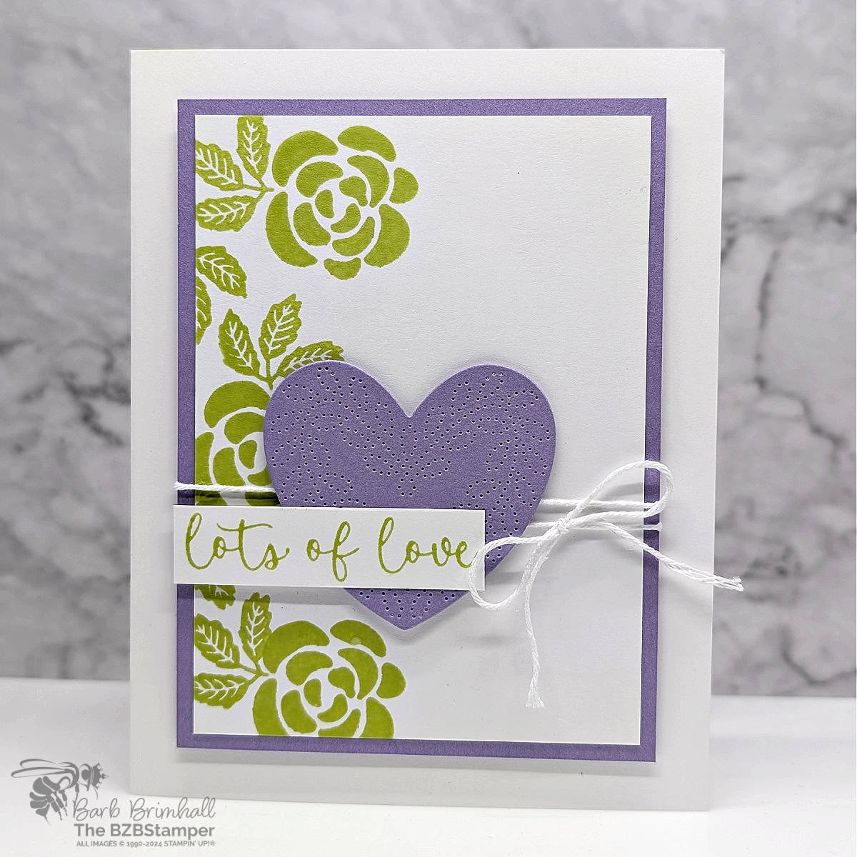 Sending Lots of Love with the Hearts of Elegance 1 Sending Lots of Love with the Hearts of Elegance Bundle using green flowers and leaves and a purple die-cut heart. Sentiment is "lots of love".