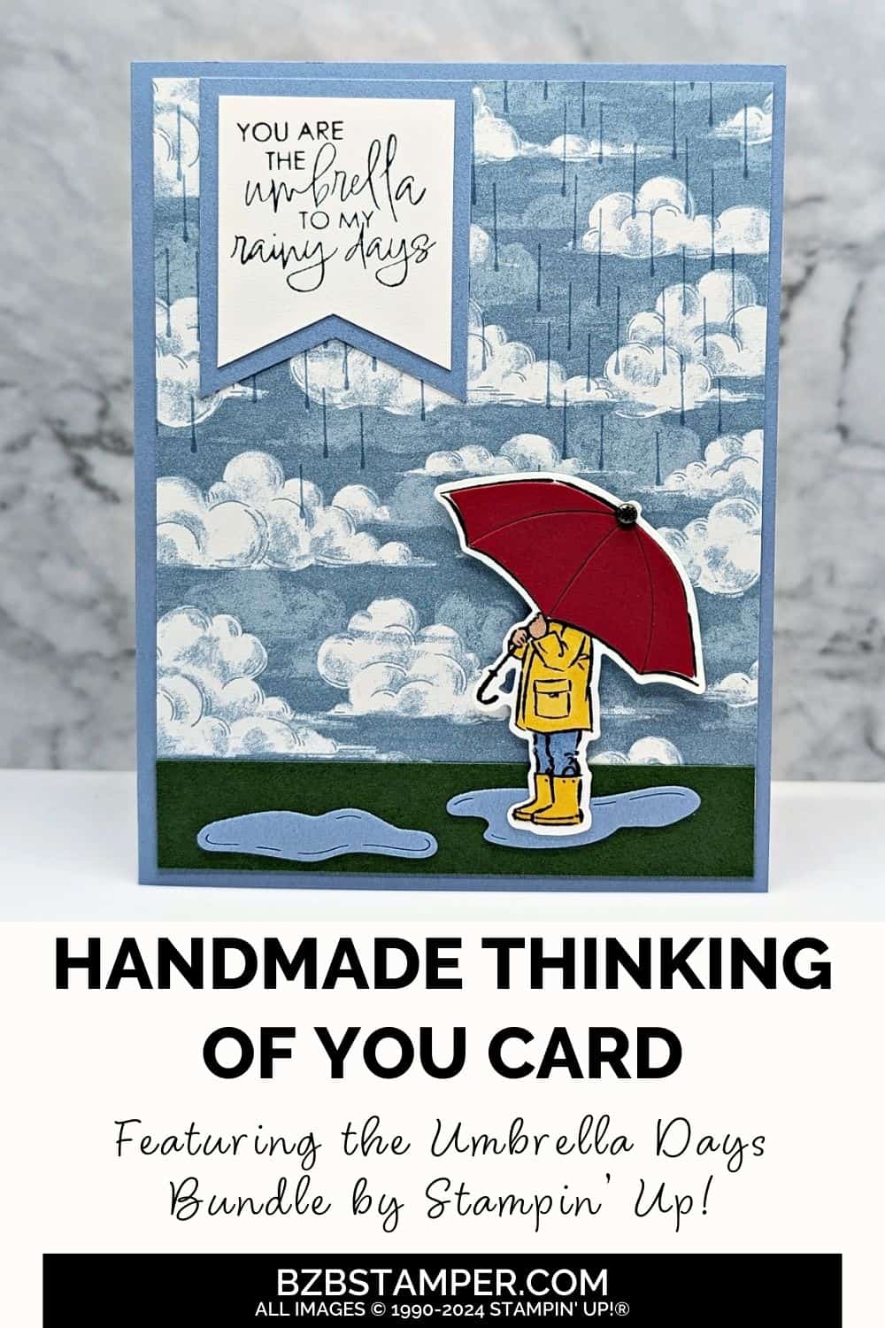 You Are the Umbrella to My Rainy Days 5 You Are the Umbrella to My Rainy Days handmade card featuring rainclouds and raindrops in blues and a person holding a red umbrella with the sentiment "you are the umbrella to my rainy days."