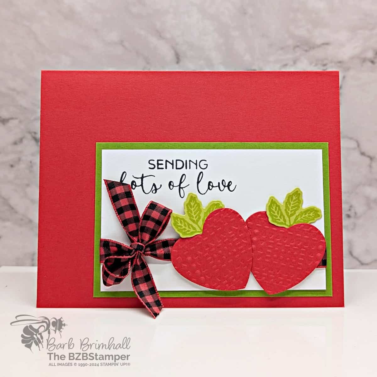 Strawberry Love Card with Hearts of Elegance Bundle 1 Strawberry Love Card with Hearts of Elegance Bundle featuring 2 red strawberries with green leaves and a red check ribbon with the sentiment "sending lots of love."