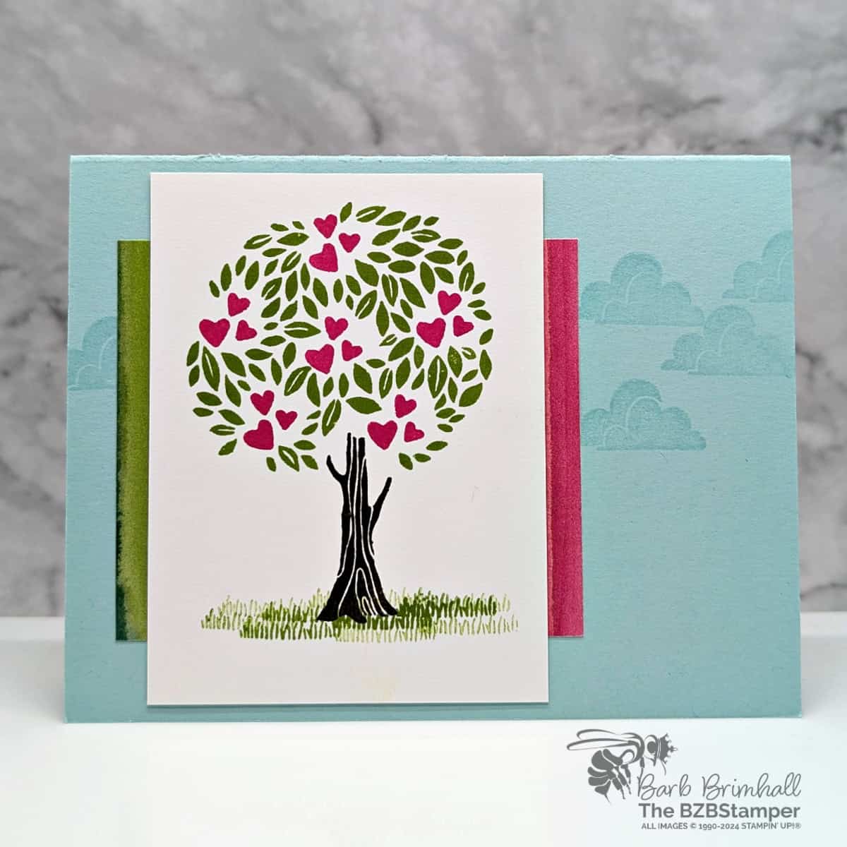 Handmade Card for Any Occasion with Pick A Season 1 This Handmade Card for Any Occasion with Pick A Season featuring a tree with hearts snuggled in the tree, fun paper, and a blue background with clouds. No sentiment on this card.