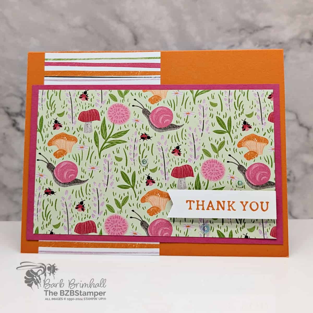 Quick and Easy Toadstools Garden Card 1 Quick and Easy Toadstools Garden Card featuring the whimsical Toadstools Garden paper in oranges and pinks and a thank you sentiment.