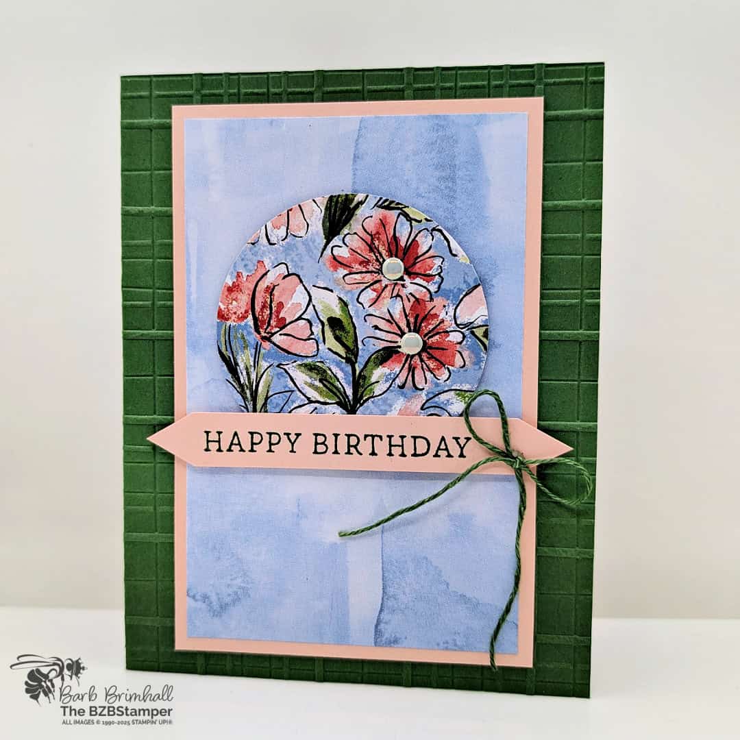 5 Minute Birthday Card Using Card Sketch 37 in blues, pinks and greens with a circle of beautiful floral paper and an embossed plaid background.