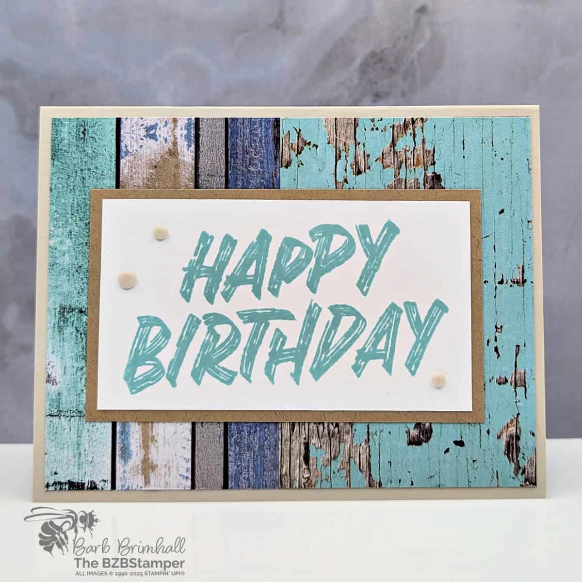 Easy Masculine Card with the Layered Thoughts Stamp Set 1 Easy Masculine Card with the Layered Thoughts Stamp Set and Country Woods Paper in blues and browns. Sentiment is "Happy Birthday" in a bold font on Basic Beige Cardstock.