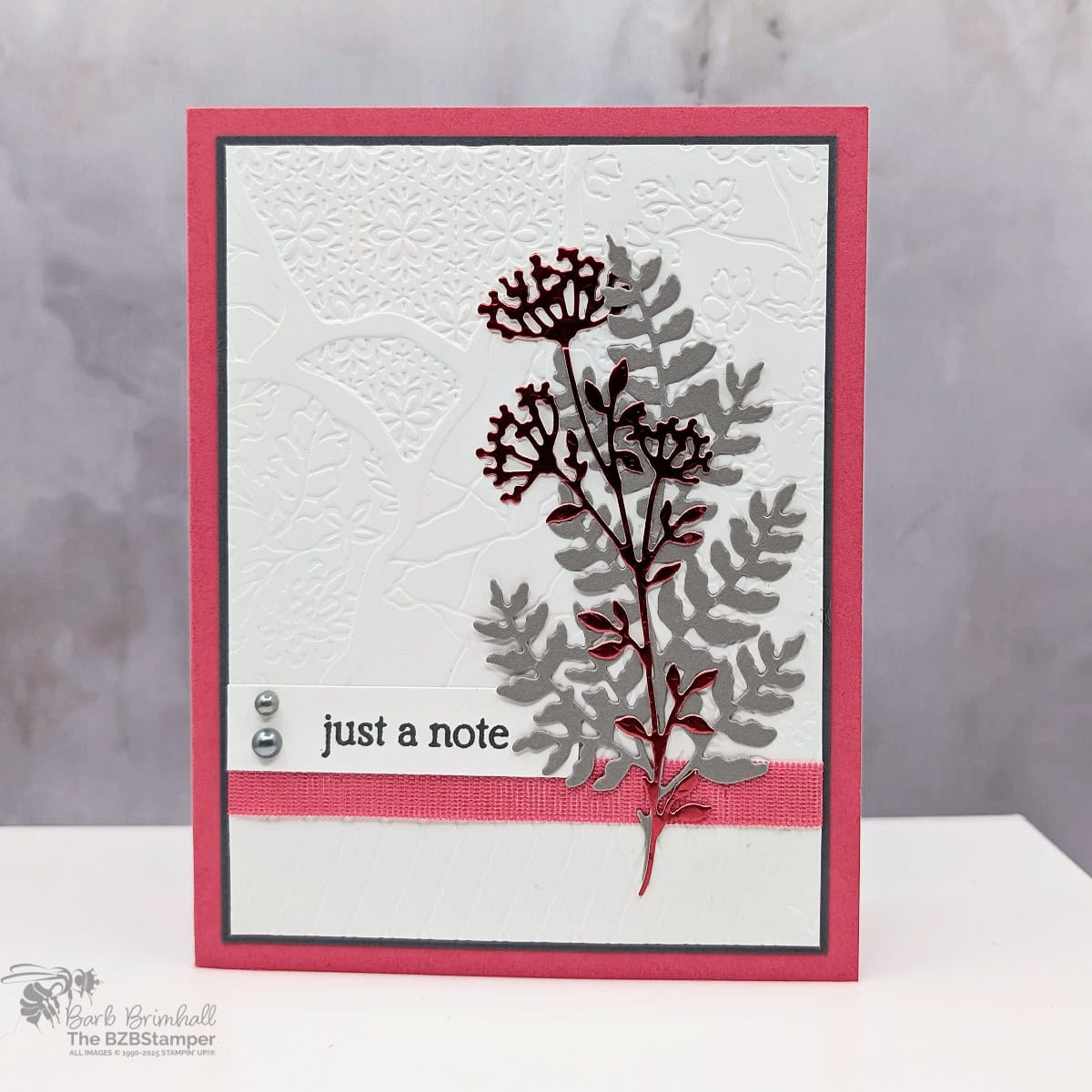 Just a Note Made With the Beautiful Motifs Bundle featuring an embossed background and die cut floral images in gray and red foils.  Sentiment is "just a note" and includes pearl embellishments.