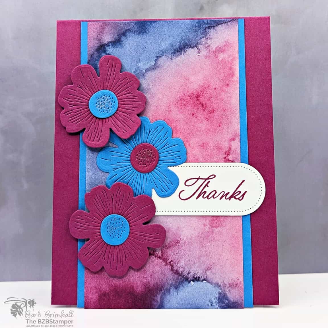 Coffee and a Card with the Impressions Abloom Bundle 1 Coffee and a Card with the Impressions Abloom Bundle in purples and blues with a watercolor background, die-cut flowers and a "thanks" sentiment.