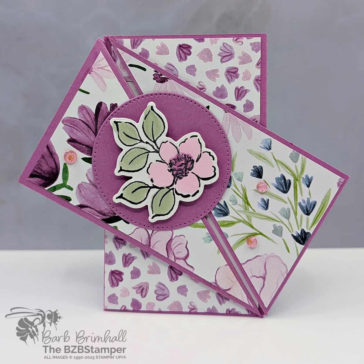 Coffee and a Card with a Charming Day Fun Fold 1 Coffee and a Card with a Charming Day Fun Fold in purples, pinks, and greens, with pretty paper and very unique fun fold. Front of card features a die-cut flower on a die-cut circle.
