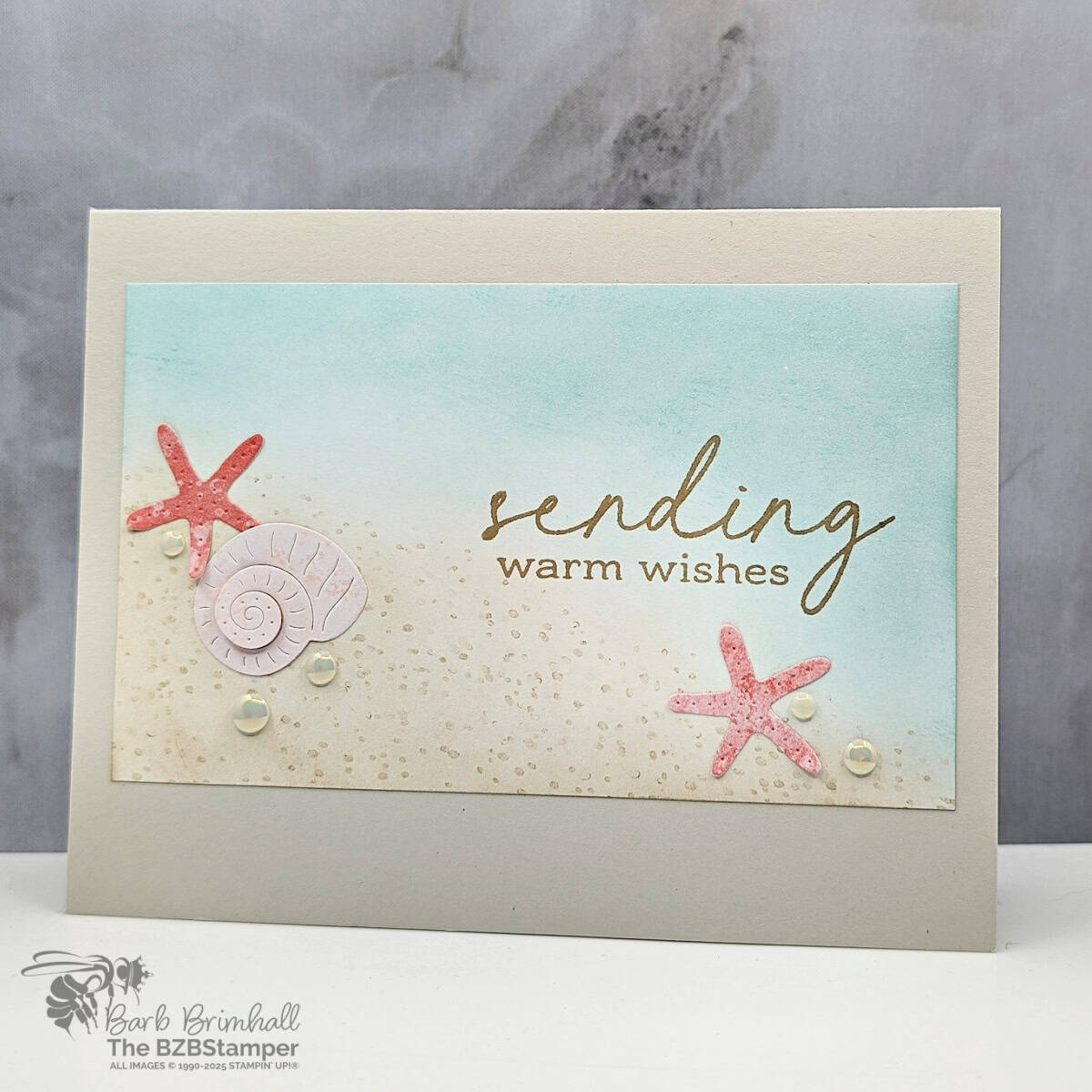 Summer Card Idea using the Notes and Totes Bundle featuring pinks and blues with shell die-cuts and a "sending warm wishes" sentiment.  Also features pretty pearl embellishments.