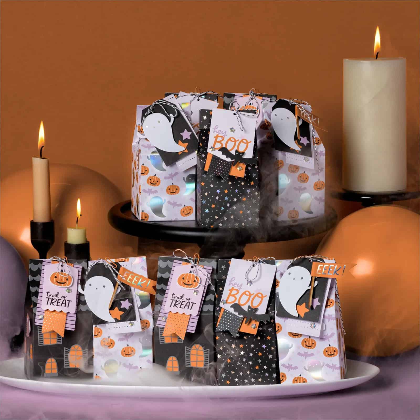 Sweet Treats Made Simple with the Sweet and Spooky Kit 4 Sweet Treats Made Simple with the Sweet and Spooky Kit makes 15 treat boxes in orange, purple and black. Picture shows the finished treat boxes.