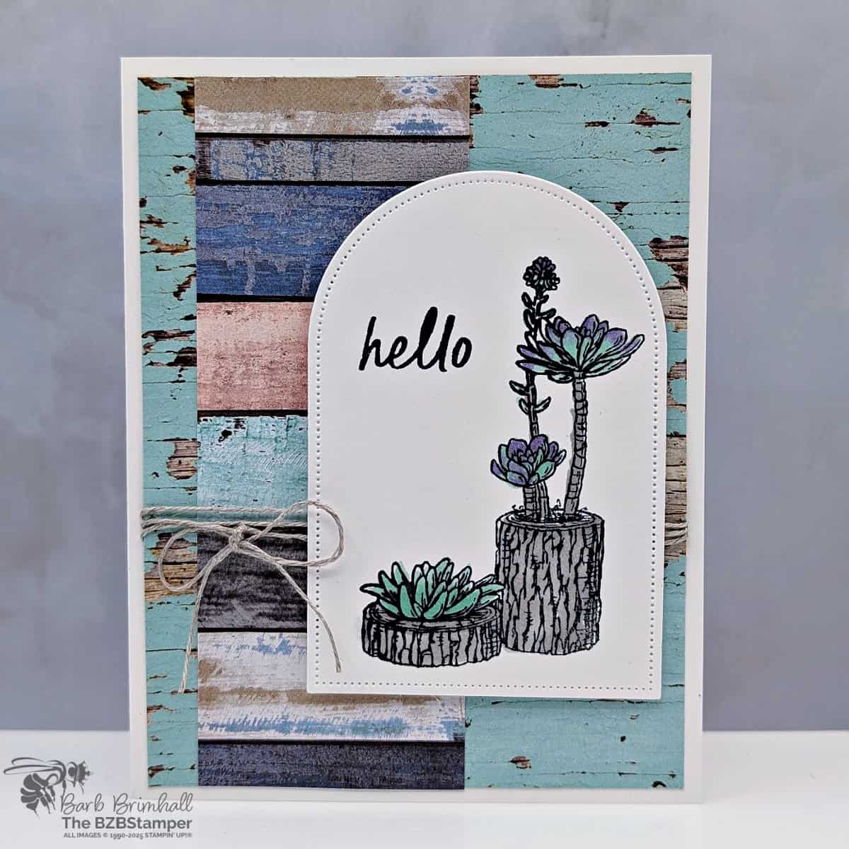 Coffee and a Card with Rustic Centerpiece featuring succulent plants in greens and purples and beachy woodgrain paper.  Sentiment is "hello"
