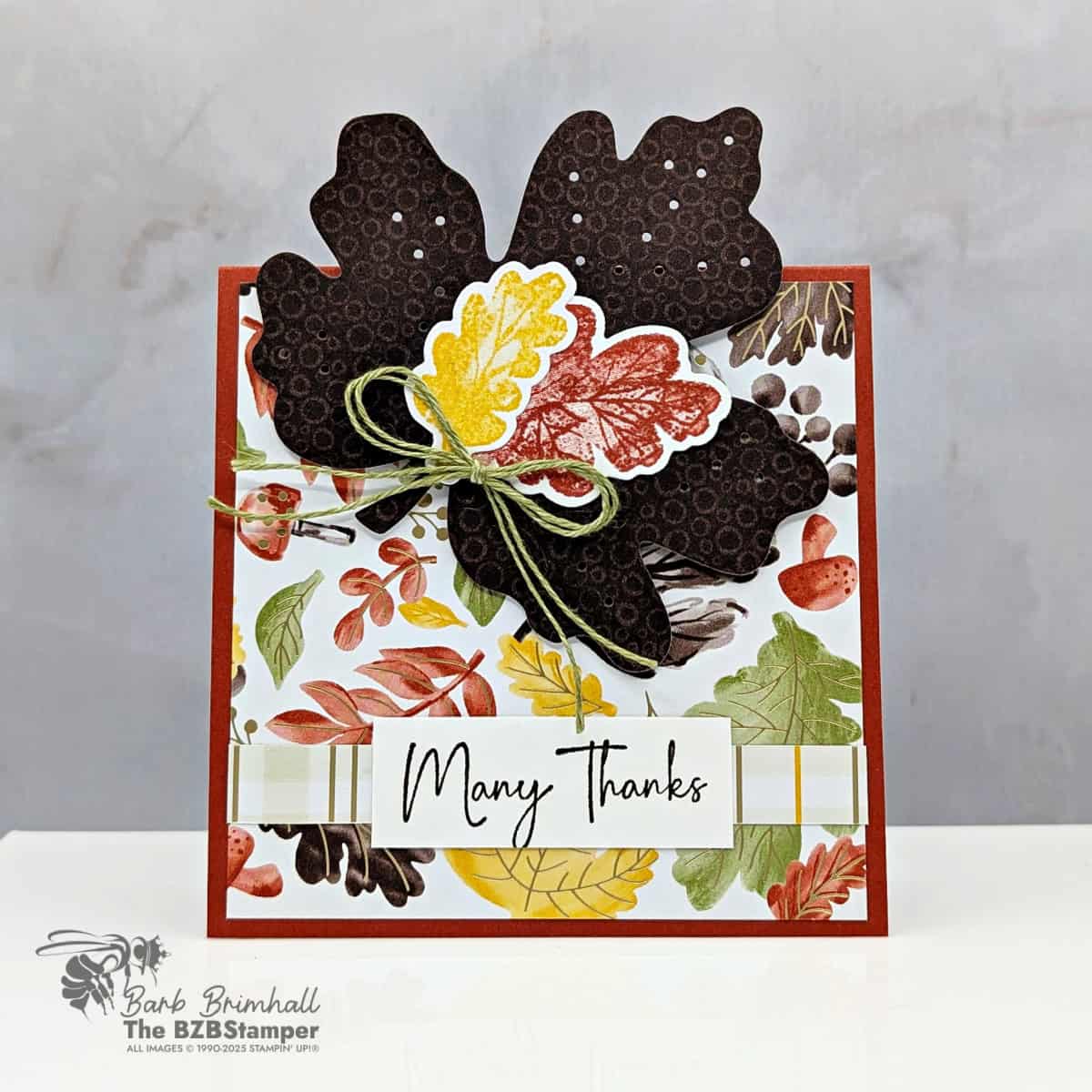 Coffee and a Card with the Gathering Moments Bundle features a square handmade fall thank you card featuring the Gathering Moments Bundle. Designed with layered die-cut leaves in Early Espresso, Cajun Craze, and Crushed Curry, accented with patterned fall paper and a simple green bow tied around the center.