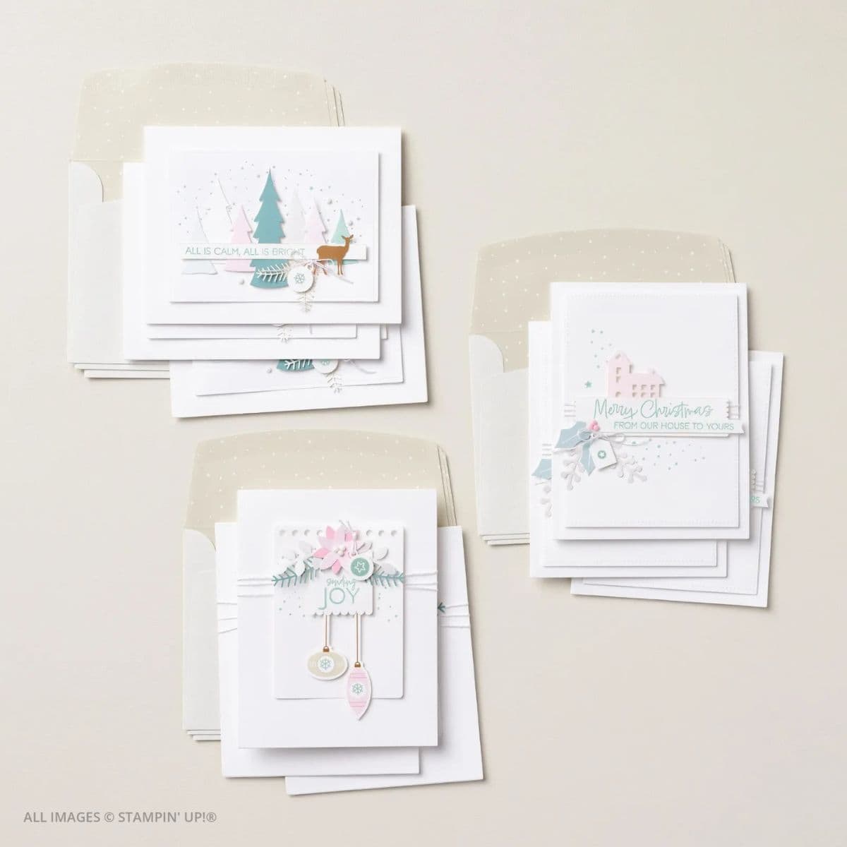 Calm & Bright Kit for Simple Handmade Christmas Cards 1 Calm & Bright Kit for Simple Handmade Christmas Cards picture of flat lay of completed handmade Christmas cards from the Calm & Bright Kit, featuring soft pastel designs, layered die-cuts, and coordinating envelopes with subtle shimmer.