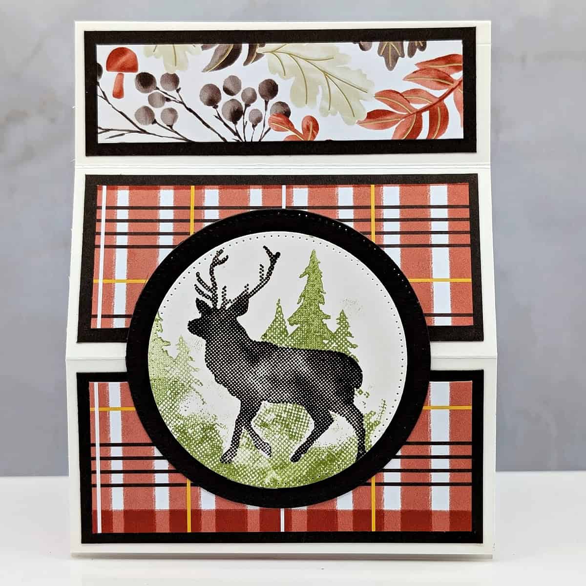 Coffee and a Card with the Outdoor Adventure Set 1 Coffee and a Card with the Outdoor Adventure Set Handmade masculine fun-fold card created with the Outdoor Adventure Stamp Set by Stampin’ Up!®, featuring a deer silhouette and plaid background in Cajun Craze and Early Espresso.