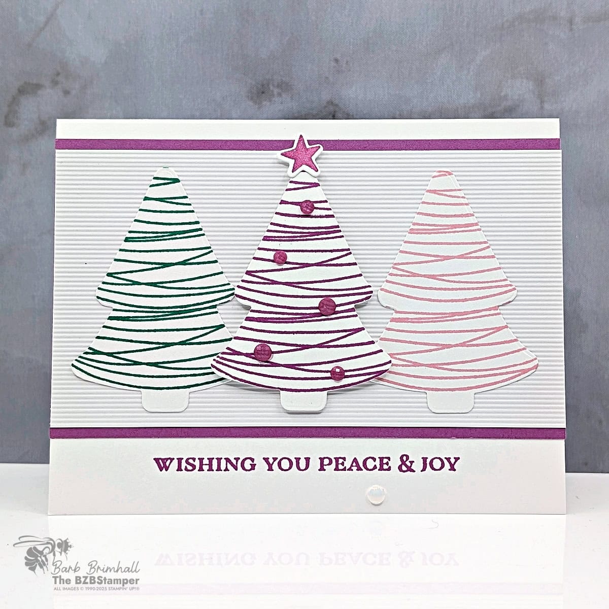 Pretty pastel Christmas Card Idea for the Holidays featuring 3 stamped trees 
in Petunia Pop, Shy Shamrock, and Pretty in Pink with Whispers of Texture Specialty Paper and Ornamental Christmas Dies by Stampin’ Up!®, and a "Wishing You Peace & Joy" sentiment.