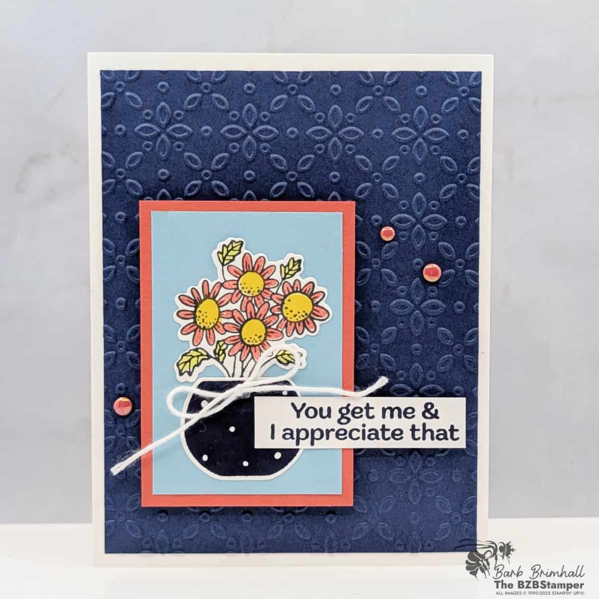 A Cheerful Flower Card with Pop Up Petals Bundle featuring bright  orange and yellow flowers in a vase on blue panel and embossed navy background with a "you get me & I appreciate that" sentiment.